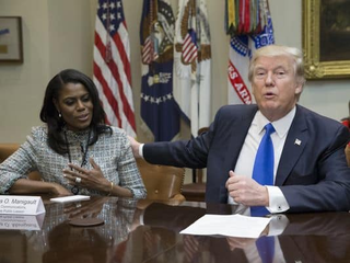 Omarosa Manigault Newman with President Donald Trump on Feb. 1. (Pool photo by Michael Reynolds)
